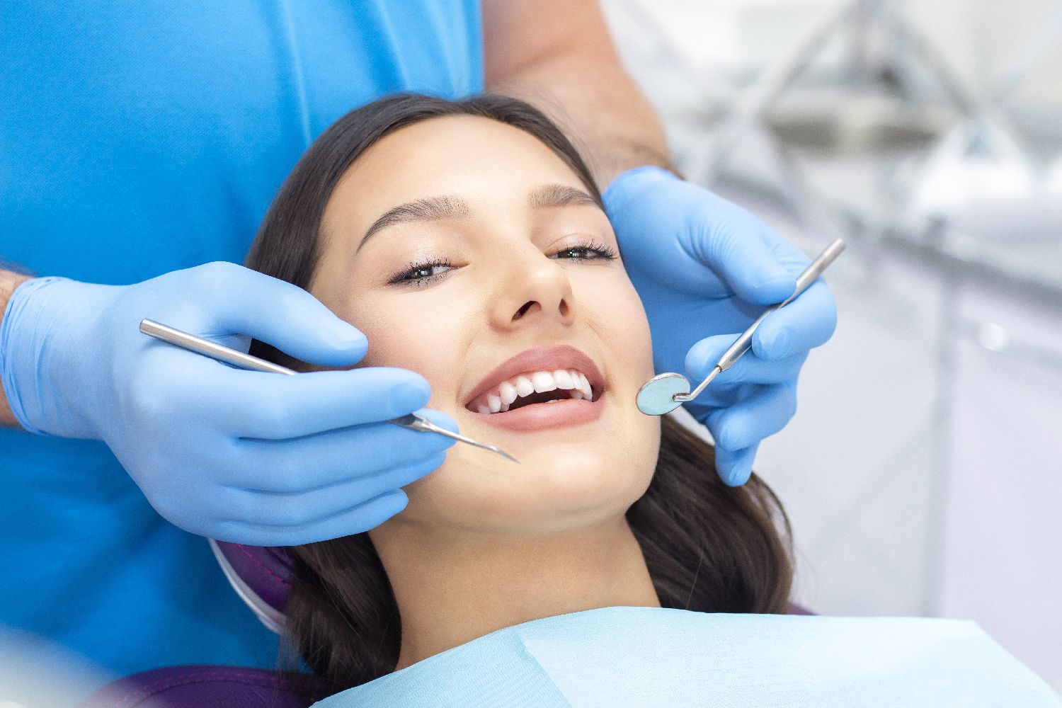 Dentist carrying out a dental examination for a patient